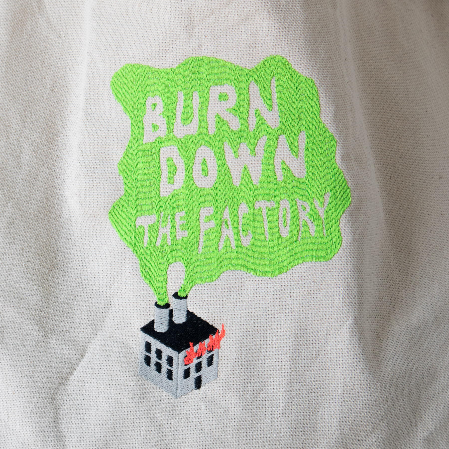 Product image - canvas tote bag with Burn Down the Factory embroidery design detail